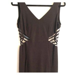 A formal black dress with see through sides